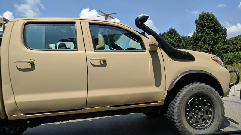 Illustration for article titled Check Out This Militarized Toyota Hilux and Its Weird Door Handles